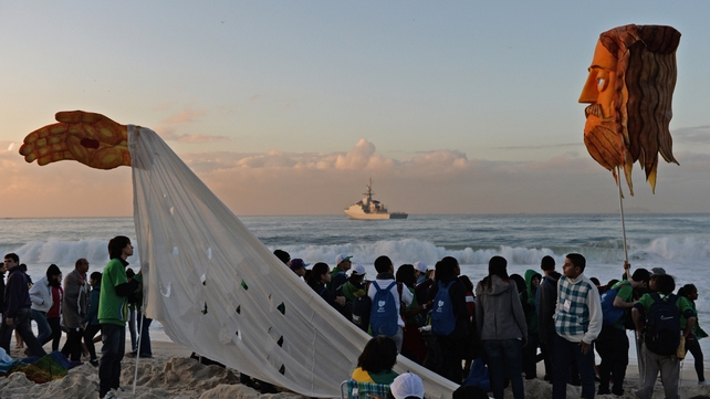 Pilgrims begin to gather after spending a night on the beach