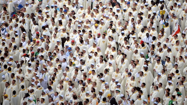 Priests await the arrival of Pope Francis