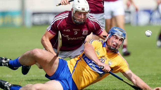 Conor Ryan of Clare and Andrew Smith of Galway fought for the sliotar on the deck