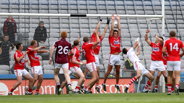 Cork defenders fail to stop Michael Meehan scoring a goal during their clash with Galway at Croke Park