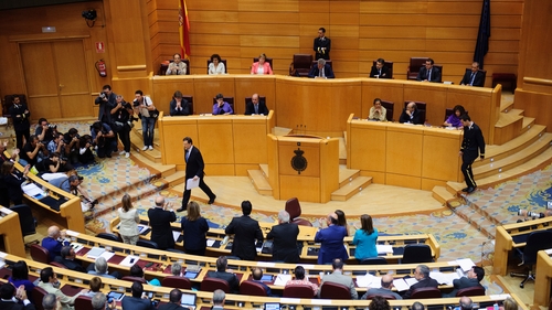 Mariano Rajoy walks away from the podium after speaking at a special session of parliament