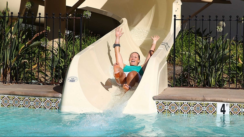 Sam Stosur goes down the ceremonial water slide after victory at La Costa Resort & Spa in California