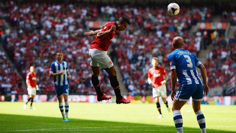 Robin van Persie heads home United's opening goal