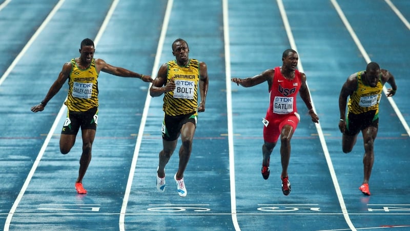 Usain Bolt crosses the line to win the 100m world title