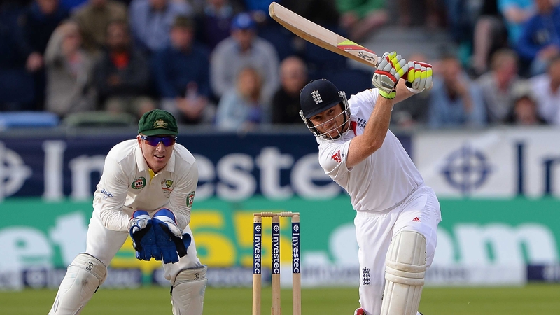 Ian Bell (R) hits a boundary, watched by Australia's Brad during play on the third day of the fourth Test match