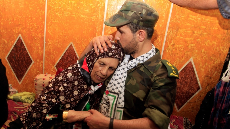 Freed Palestinian prisoner Salah al-Sahair kisses his mother following his return to Gaza