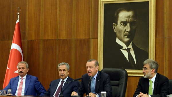 Turkish Prime Minister Recep Tayyip Erdogan (2R) called for an urgent UN Security Council meeting on Egypt