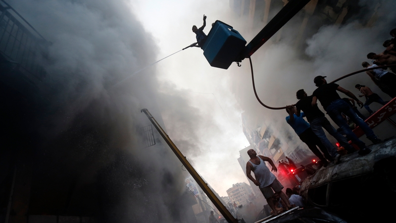 The blast sent a column of black smoke over the city