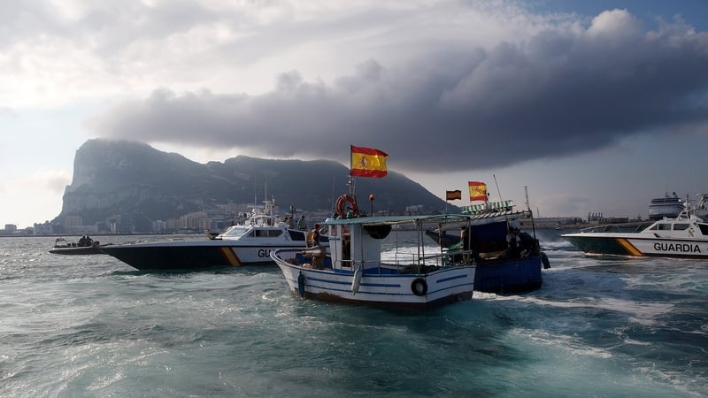 A Gibraltar police boat, Spanish Guardia Civil boat and Spanish fishing boats sail during a protest by Spanish fishermen in the sea near the Spain/Gibraltar border