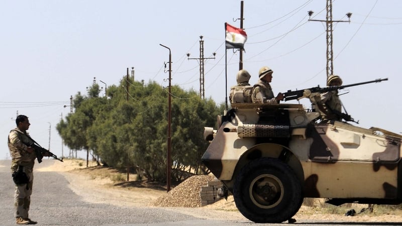 Egyptian soldiers stand guard in the area of the Rafah Crossing