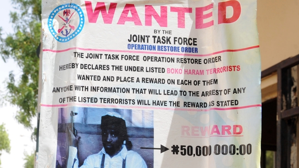 A poster offers a reward for the capture of Boko Haram's leader