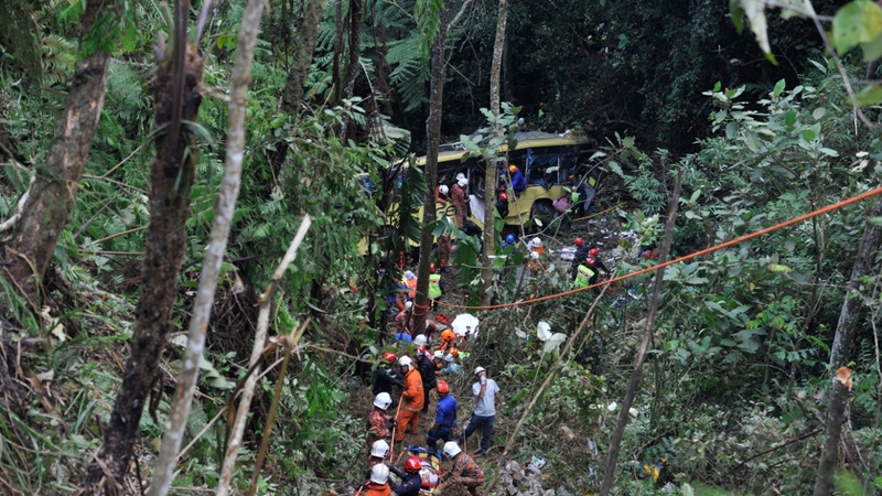 Rescuers take survivors from wreckage of bus crash