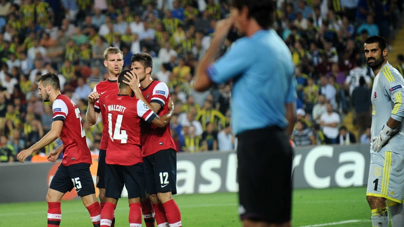 Olivier Giroud gets the congratulations after scoring from the penalty spot