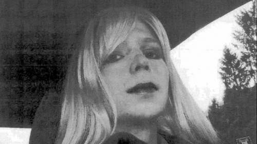 A US Army handout shows Chelsea Manning wearing a long blonde wig and lipstick