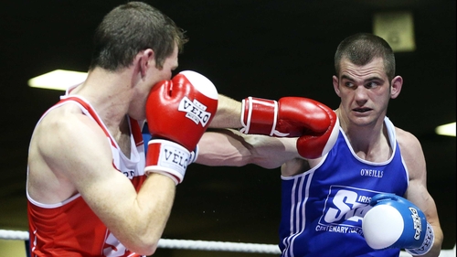 Adam Nolan (blue) will face Bernard Roe in a welterweight semi-final