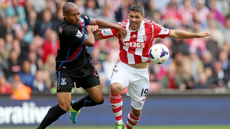 Danny Gabbidon (L) grapples with Jonathan Walters of Stoke