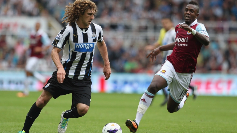 Newcastle's Fabricio Coloccini and Modibo Maiga of West Ham