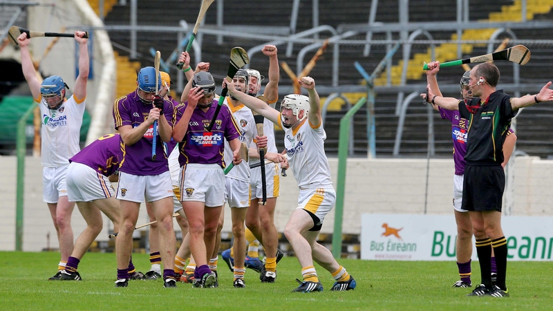 Antrim players celebrate at full time