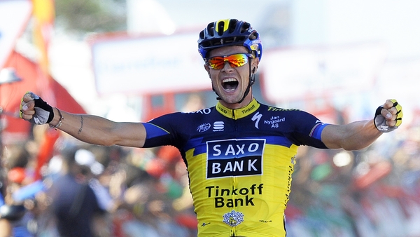 Roche wins first Grand Tour stage