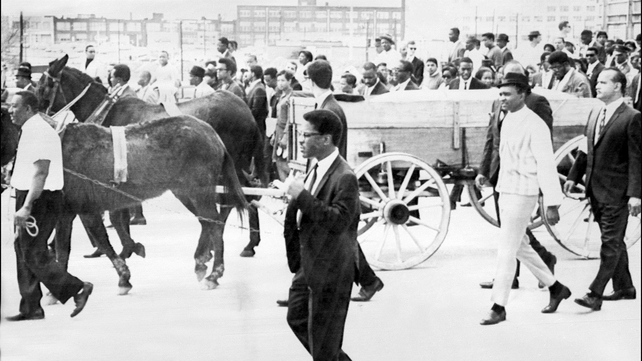 Two mules pull a cart carrying King's coffin during his funeral in Atlanta