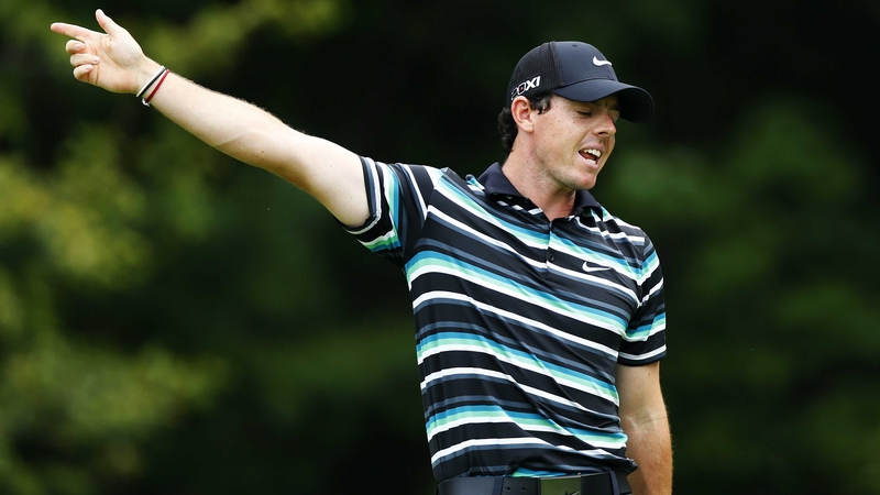 Rory McIlroy looks away in disgust as his drive did not go straight down the middle