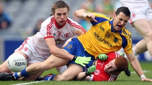 Diarmuid Murtagh of Roscommon, Rhys Quinn and goalkeeper Sean Fox of Tyrone clash during the MFC semi-final