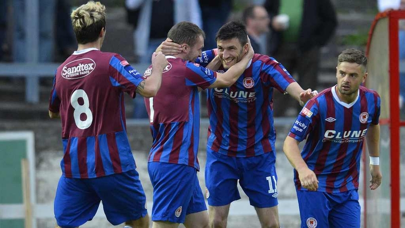 Killian Brennan celebrates with team-mates in Derry