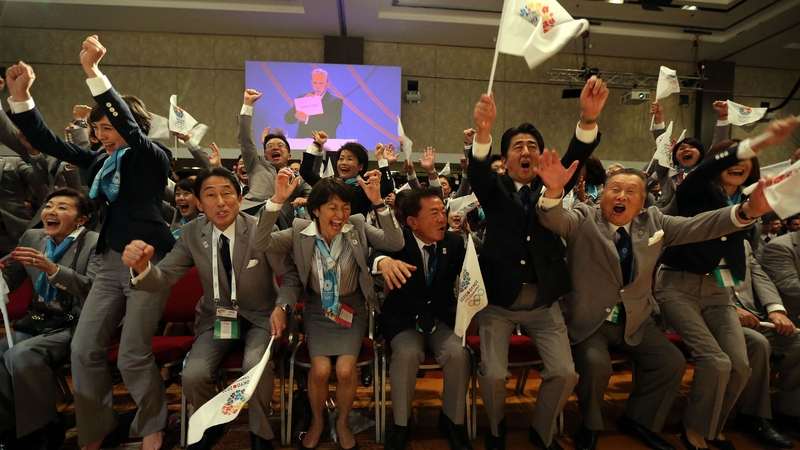 The Japanese bid team celebrates winning the rights to host the 2020 Olympic Games