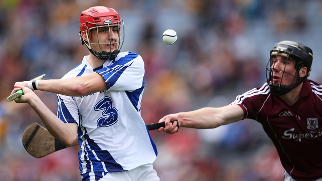 Adam Farrell of Waterford gets in his shot despite the attentions of Galway's Darragh O'Donoghue.