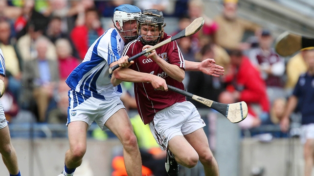 Galway's Brian Molloy breaks the tackle of Michael Harney of Waterford.
