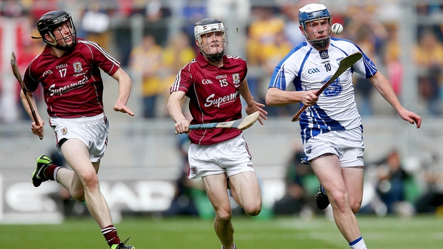 Stephen Bennett of Waterford escapes the attention of Conor Shaughnessy and Vincent Doyle of Galway.