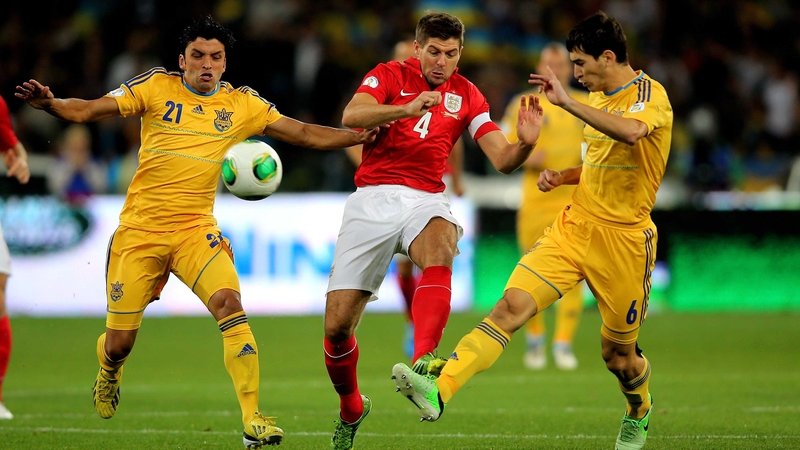 (L to R) Edmar, Steven Gerrard and Taras Stepanenko clash