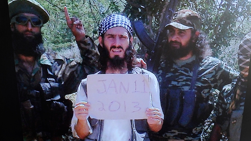 Abu Mansoor al-Amriki or 'the American' (centre), and a British national known as Usama al-Britani were shot dead in a dawn raid