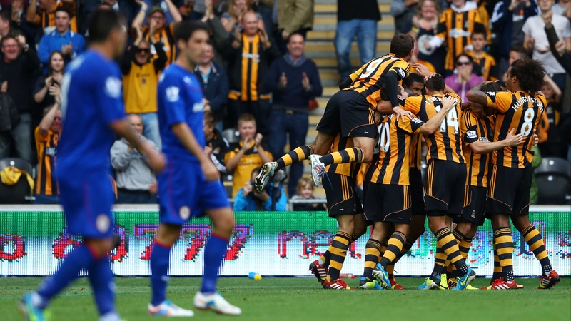 Hull City players mob goal scorer Curtis Davies at the KC Stadium