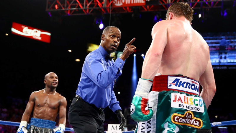 Floyd Maywether goads Canelo Alvarez as he's checked by the referee