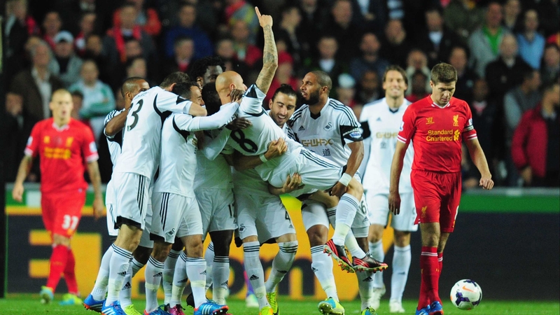 Jonjo Shelvey is mobbed following his opener