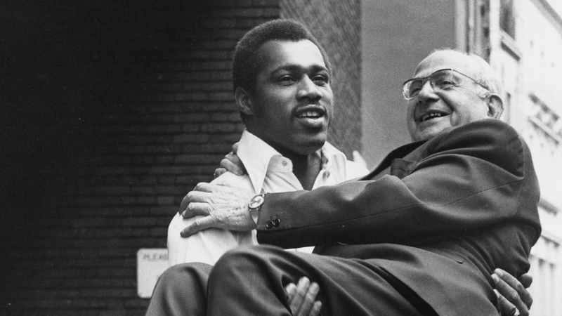 Ken Norton gives a lift to boxing promoter Jack Solomons in 1973