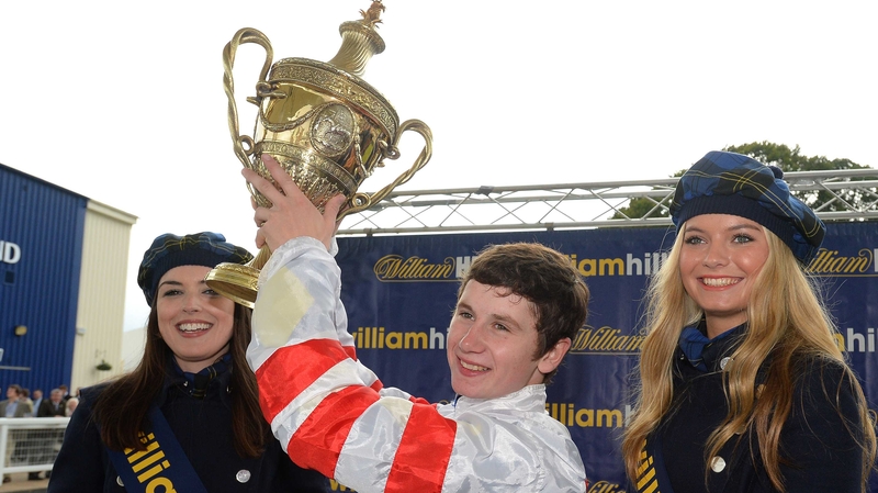 Oisin Murphy with the Ayr Gold Cup after victory aboard Highland Colori