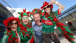 A lone Dublin fan find himself amongst three ladies supporting Mayo