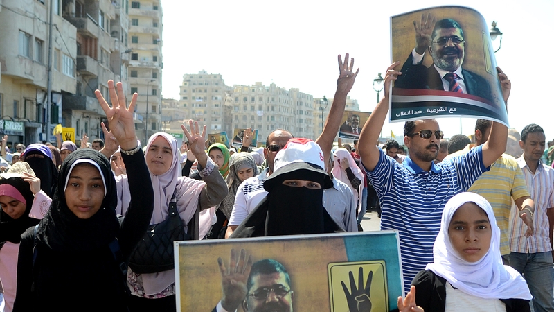 Supporters of Mohammed Mursi marching in Alexandria on Friday