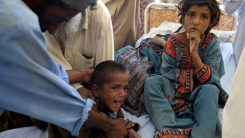 Child survivors are treated in makeshift hospital in Awaran