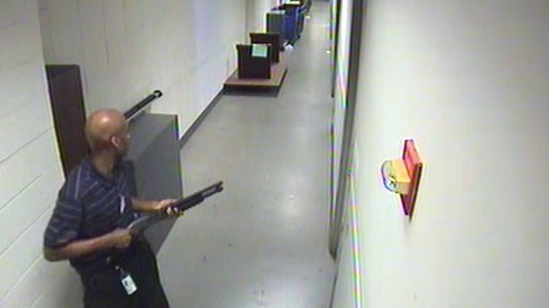 CCTV footage showed Aaron Alexis walking down a corridor with a shotgun