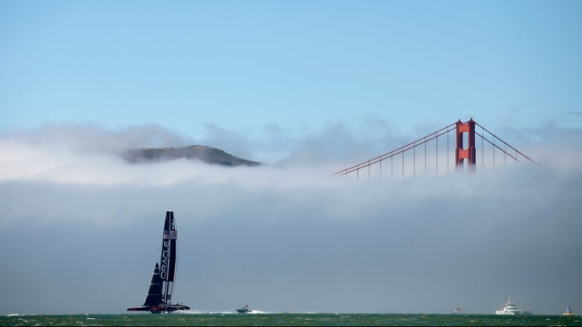 Oracle Team USA near the Golden Gate Bridge in the America's Cup finals in San Francisco, California.