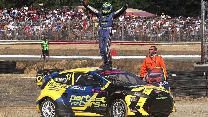 Derek Tohill celebrating after winning his 2013 ERC Touring Car series event
