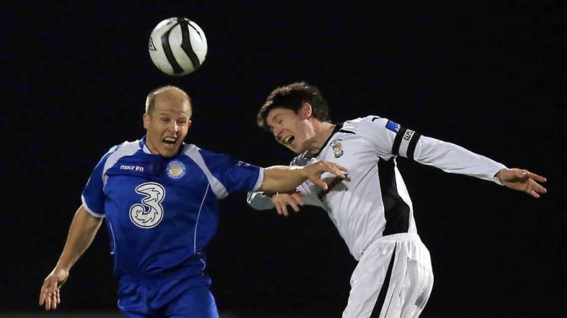 Athlone's Aidan Collins and Paul Quilty of Waterford engage in an aerial confrontation