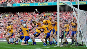 Clare players are unable to stop Cork's goalkeeper Anthony Nash