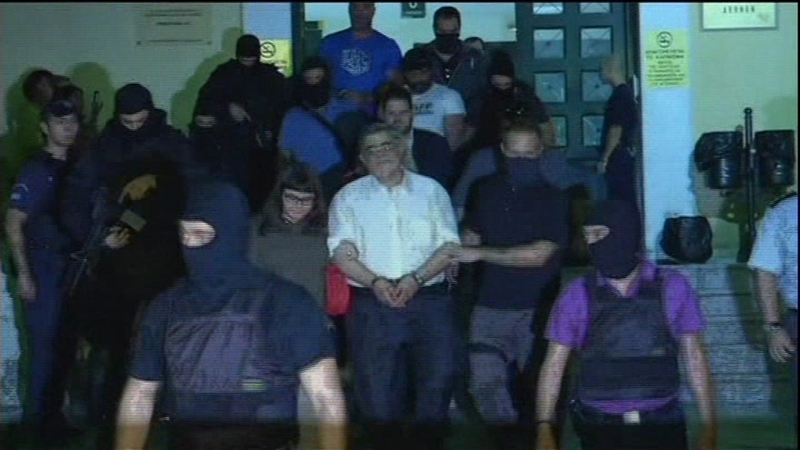 Leader of Greek far-right Golden Dawn party, Nikos Michaloliakos, taken to court under heavy security