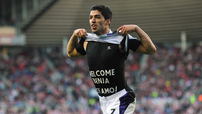 Luis Suarez celebrates scoring Liverpool's third goal at the Stadium of Light