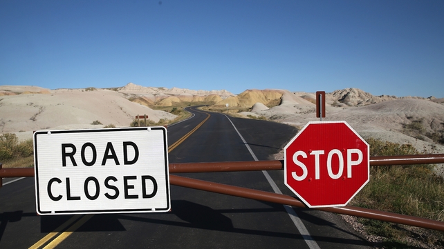 A barricade prevents visitors from entering the interior of the Badlands National Park near Wall, South Dakota
