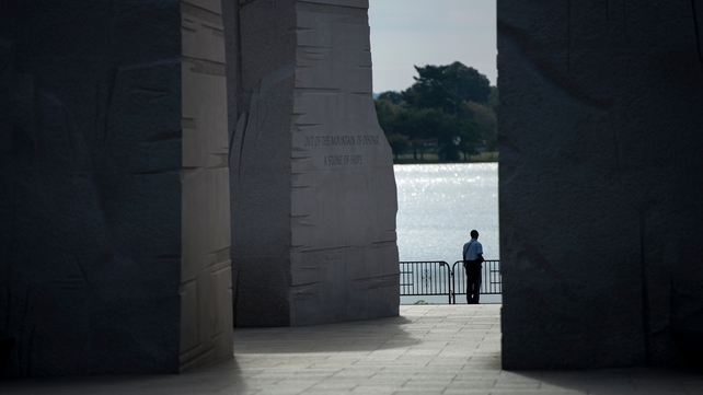 A police officer stands alone at the Martin Luther King Jr Memorial